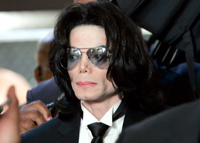Michael Jackson close-up portrait wearing sunglasses and black suit
