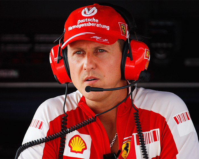 Close-up of Michael Schumacher wearing racing headset and team uniform Close-up of Michael Schumacher wearing racing headset and team uniform