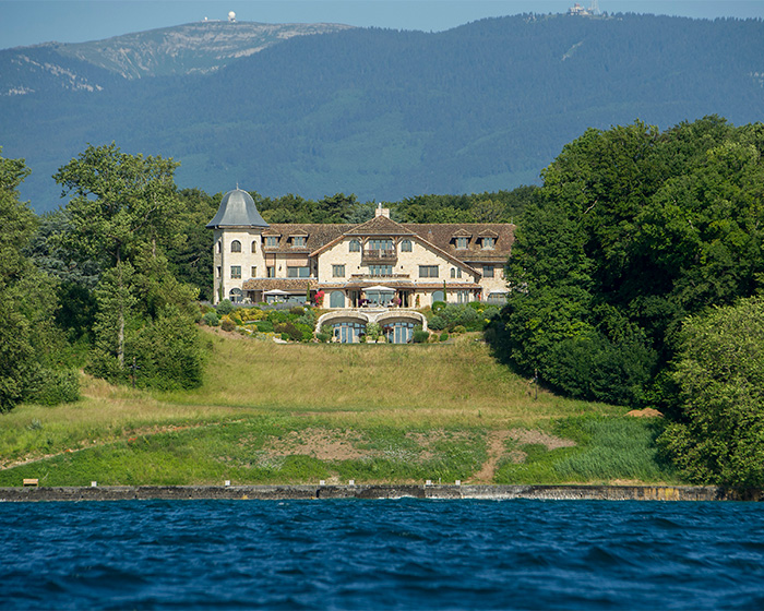 Mansion surrounded by trees and water as seen in Michael Schumacher trial context Mansion surrounded by trees and water as seen in Michael Schumacher trial context