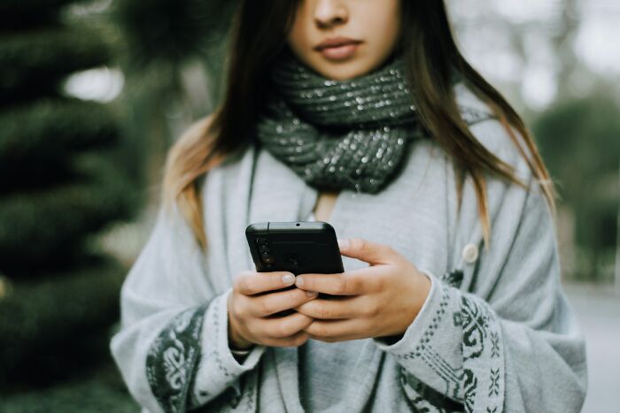 A person looking at their phone, experiencing something creepy.