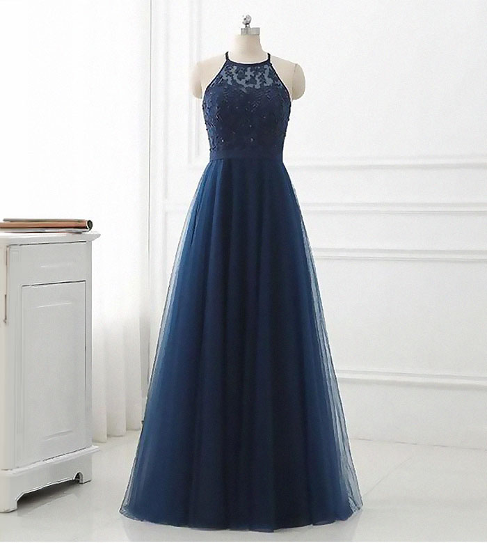 A beautiful navy blue halter neck gown, perfect for a wedding bridesmaid.