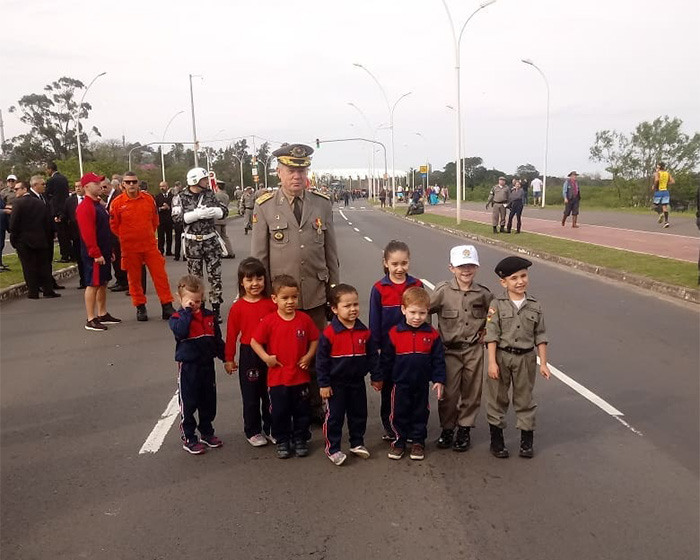 A general with young children dressed in school and military uniforms after a mom hid an audio recorder.