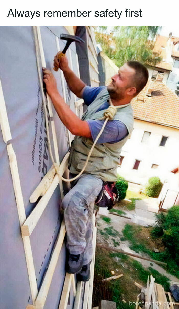 A blursed meme showing a construction worker on a ladder, precariously balanced, with a rope tied around his waist.