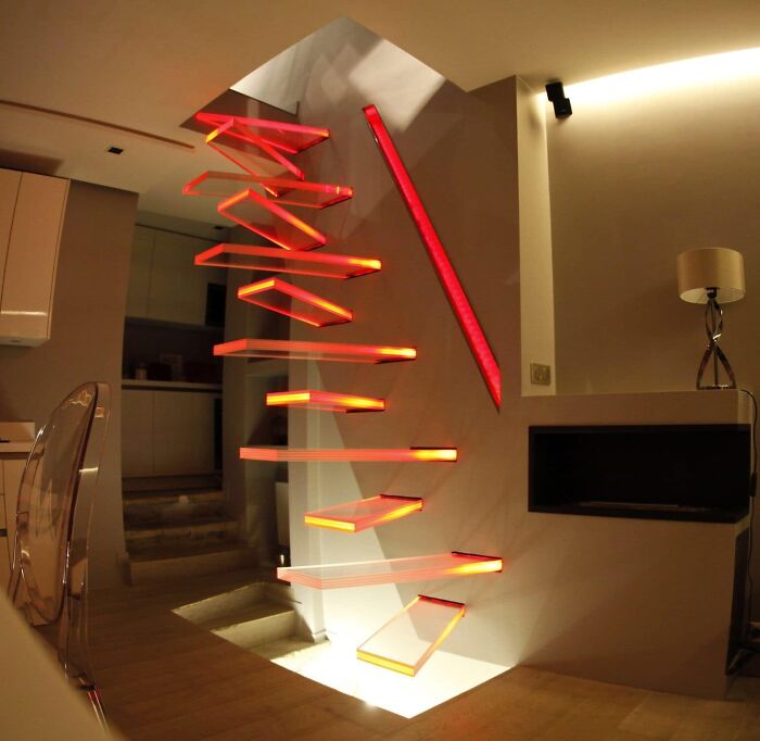 Modern floating stairs with red LED lighting, an example of design fails in architecture.