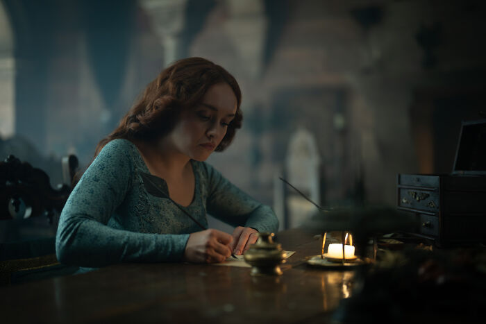 House of the Dragon season 3 premiere: A woman with red hair writes at a desk by candlelight, as boycott threats emerge. House of the Dragon season 3 premiere: A woman with red hair writes at a desk by candlelight, as boycott threats emerge.