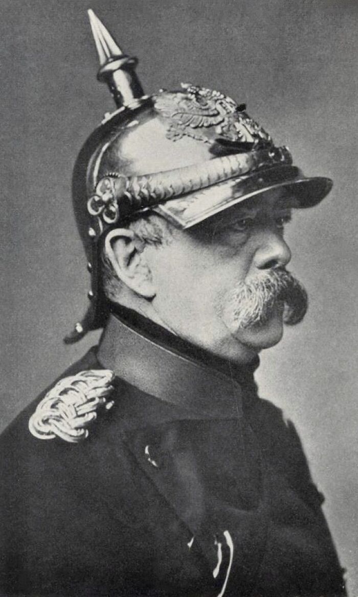 Portrait of a man in historic military uniform with spiked helmet