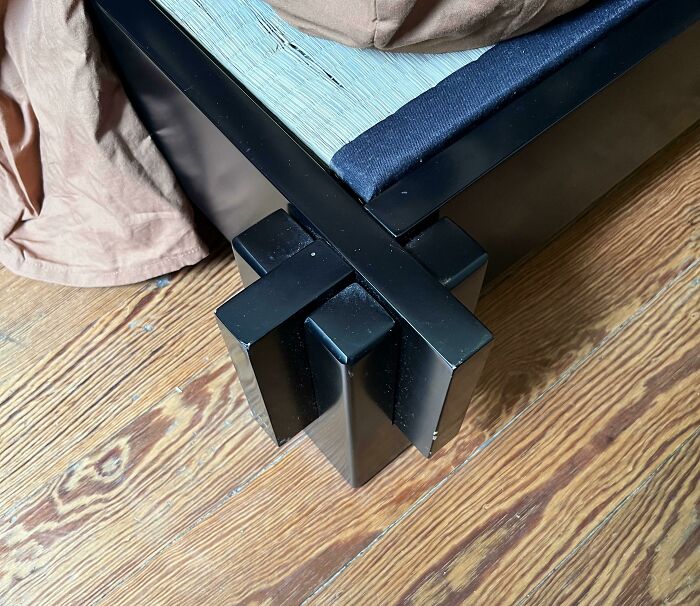 Close-up of unique bed frame corner joint exemplifying innovative furniture design