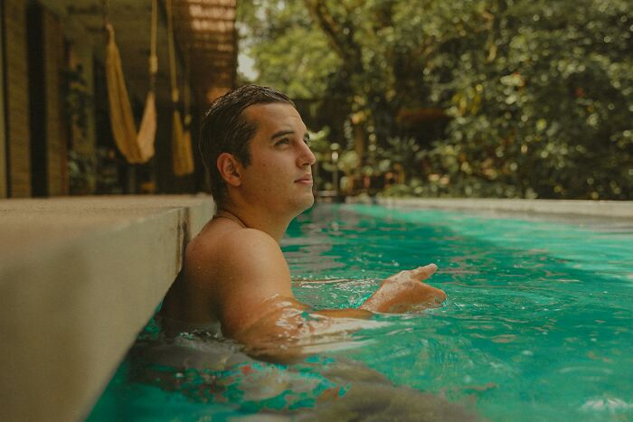 A man in a pool, reflecting on moments from his marriage that led to divorce.