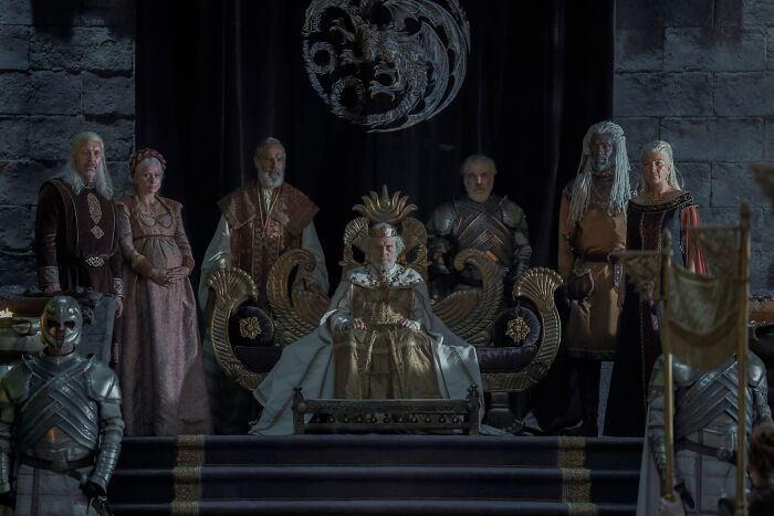 The Targaryen family tree shown with the royal family members from House of the Dragon gathered in a grand hall. The Targaryen family tree shown with the royal family members from House of the Dragon gathered in a grand hall.