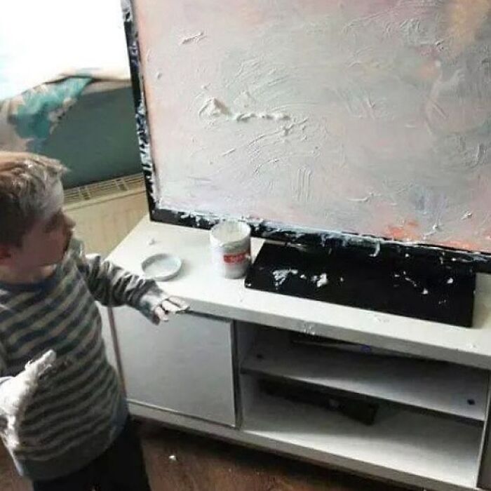 Child making a mess with white paint on TV and furniture parenting meme