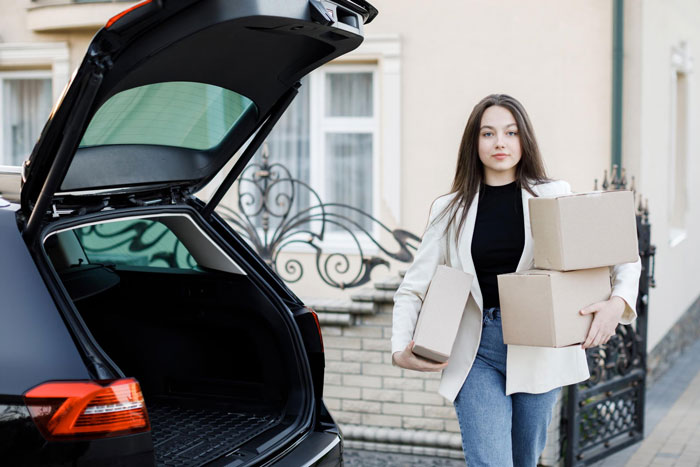 An 18YO is moving boxes into a car, dealing with her loving parents and jobless brother situation. An 18YO is moving boxes into a car, dealing with her loving parents and jobless brother situation.