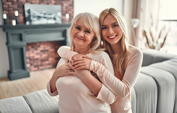 A young woman hugs her mother, illustrating the theme of loving parents and the daughter's experience. A young woman hugs her mother, illustrating the theme of loving parents and the daughter's experience.