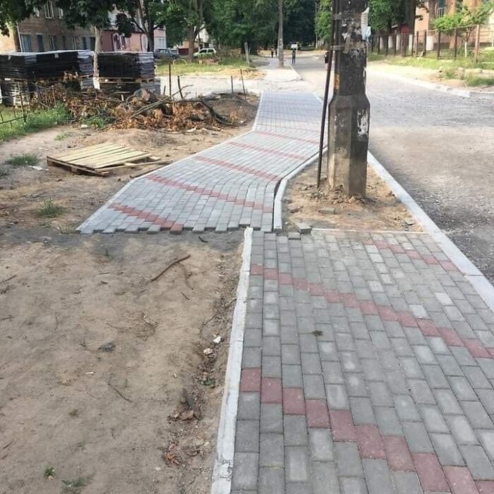 A newly paved sidewalk abruptly ends and deviates, creating a clear example of a You Had One Job fail in construction.