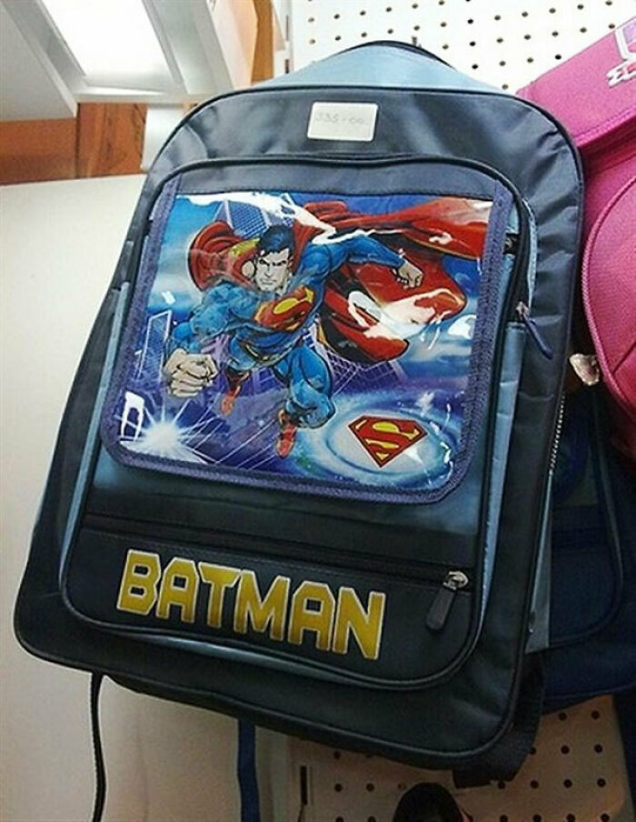 A blue backpack featuring Superman with the word BATMAN printed below, a clear You Had One Job fail.