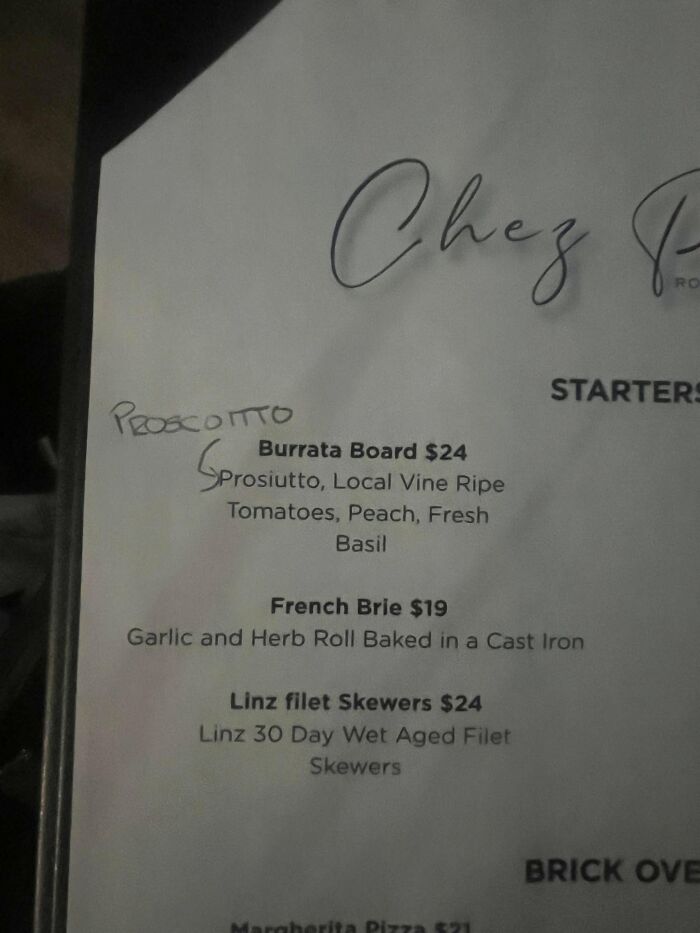 A menu with an iconic self-burn where 'proscuitto' is incorrectly written as 'prosciutto' and then corrected.
