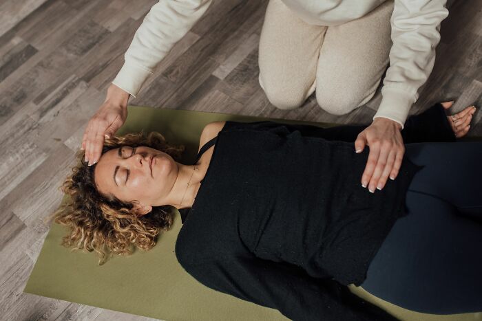 A woman meditating, realizing something was not a joke.