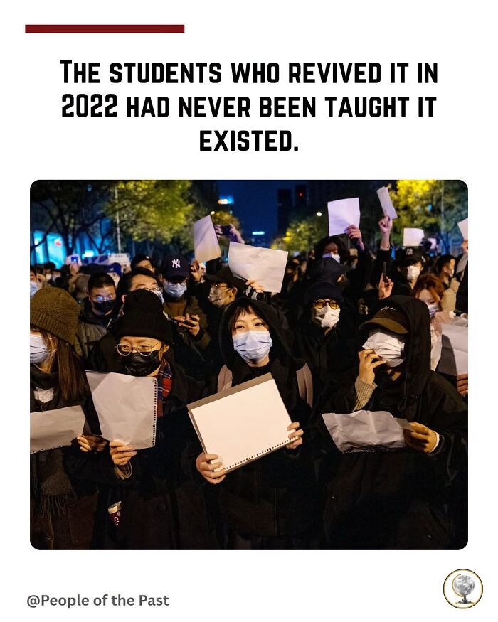 A crowd of protestors holding blank signs, an example of historical posts that feel like time travel.