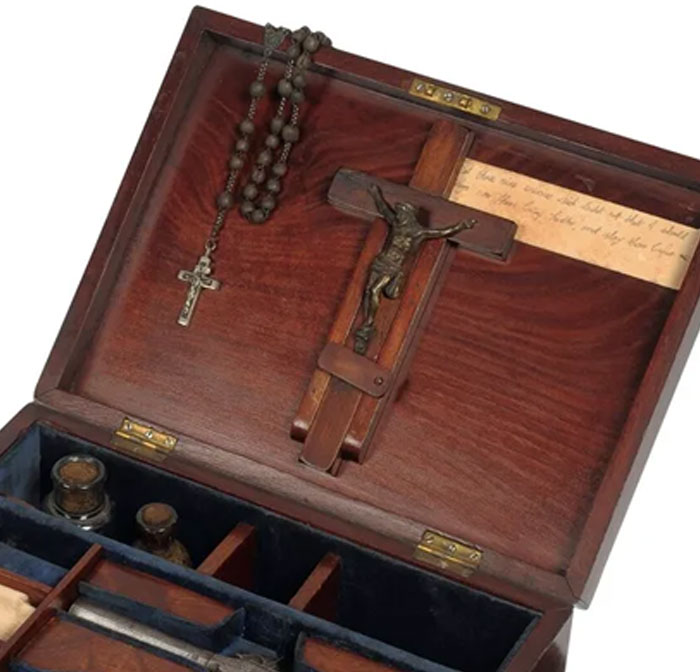 Antique priest kit with cross and rosary symbolizing unusual religious jobs