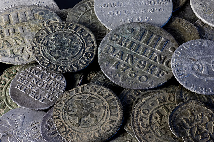 Close up of strange old coins from rare currency collection