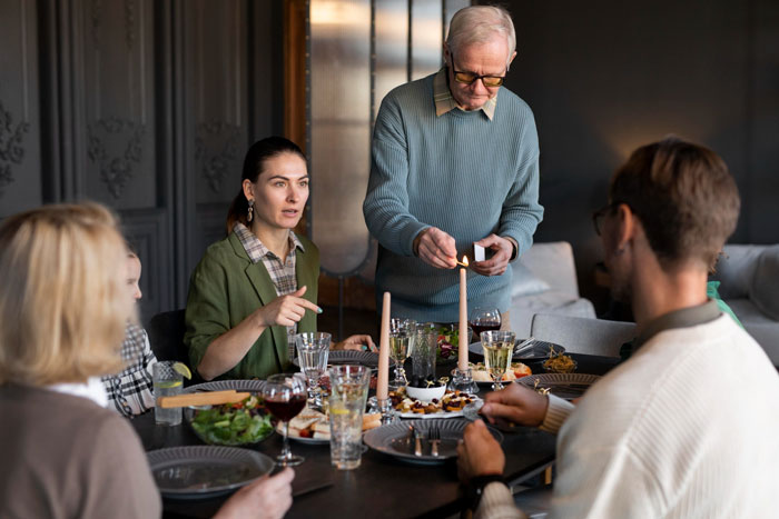 Family dinner scene with snide comments from mother-in-law and tension Family dinner scene with snide comments from mother-in-law and tension