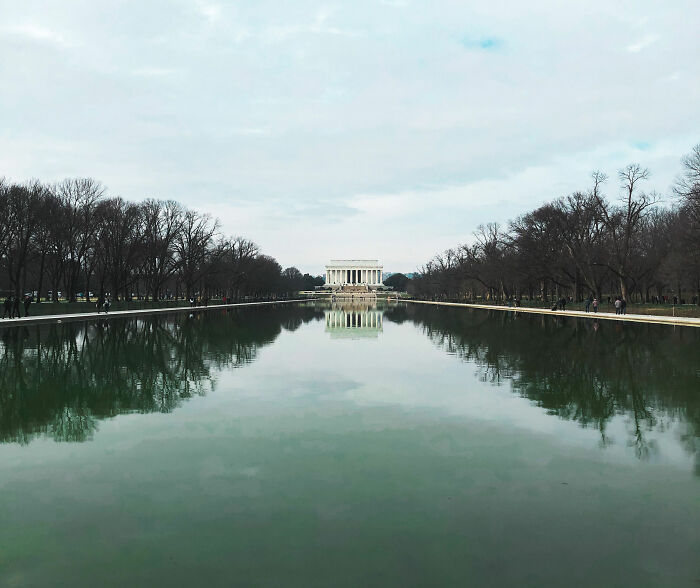 A wide shot of the Lincoln Memorial and the Reflecting Pool with bare trees on either side, pre-renovation.