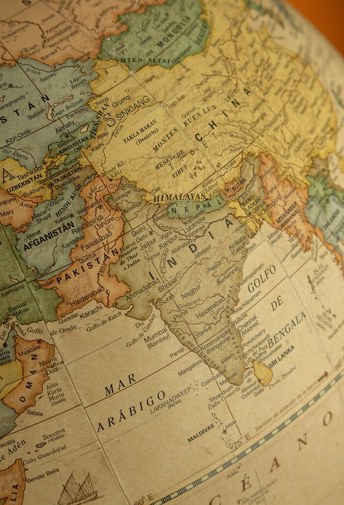 A close-up of a vintage globe focusing on Asia, highlighting interesting and surprising facts about geography.