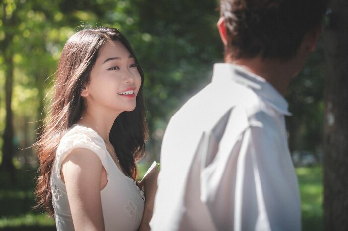 A young woman smiles, having grown up in polygamist families.