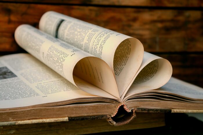 An open book with pages folded to form a heart shape, symbolizing a calming moment after people simply couldn't take it anymore.
