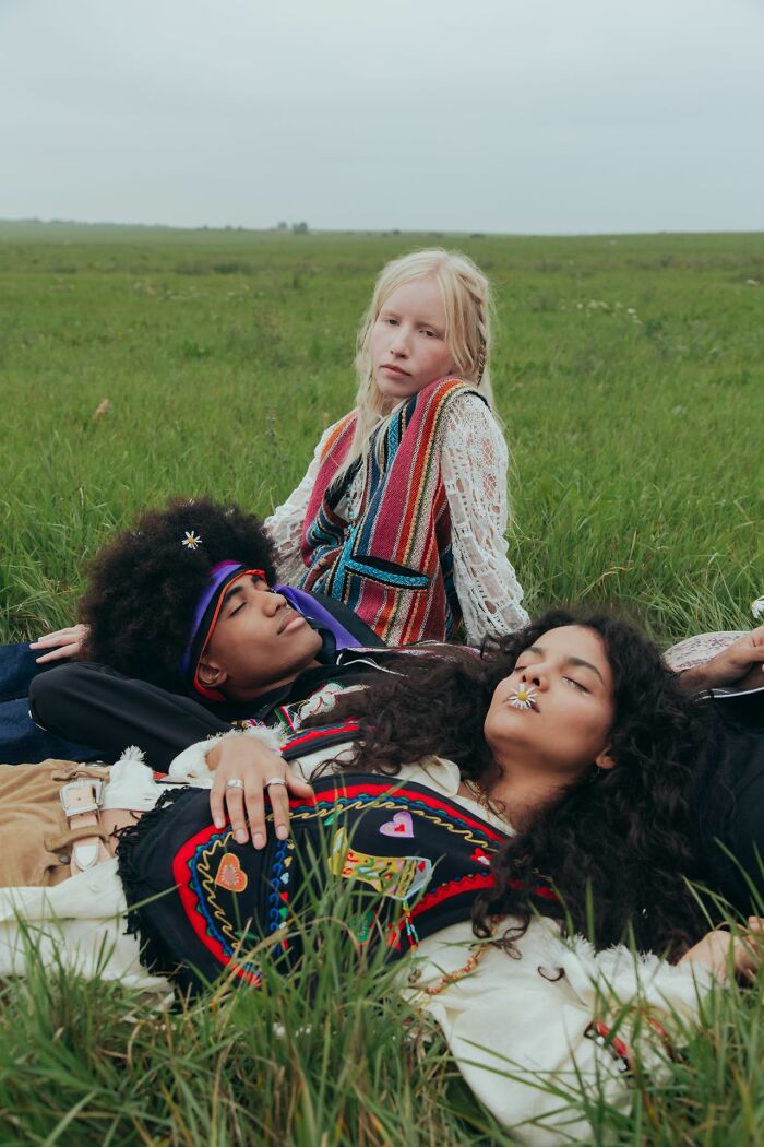 Three individuals lay in a field, sharing stories from polygamist families.