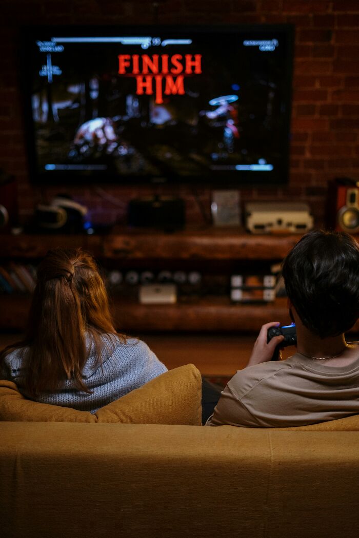 Couple playing video games showing relationship tension