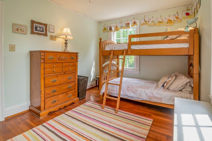 A child's room with bunk beds, where a bed compressing could be an unexplained experience.