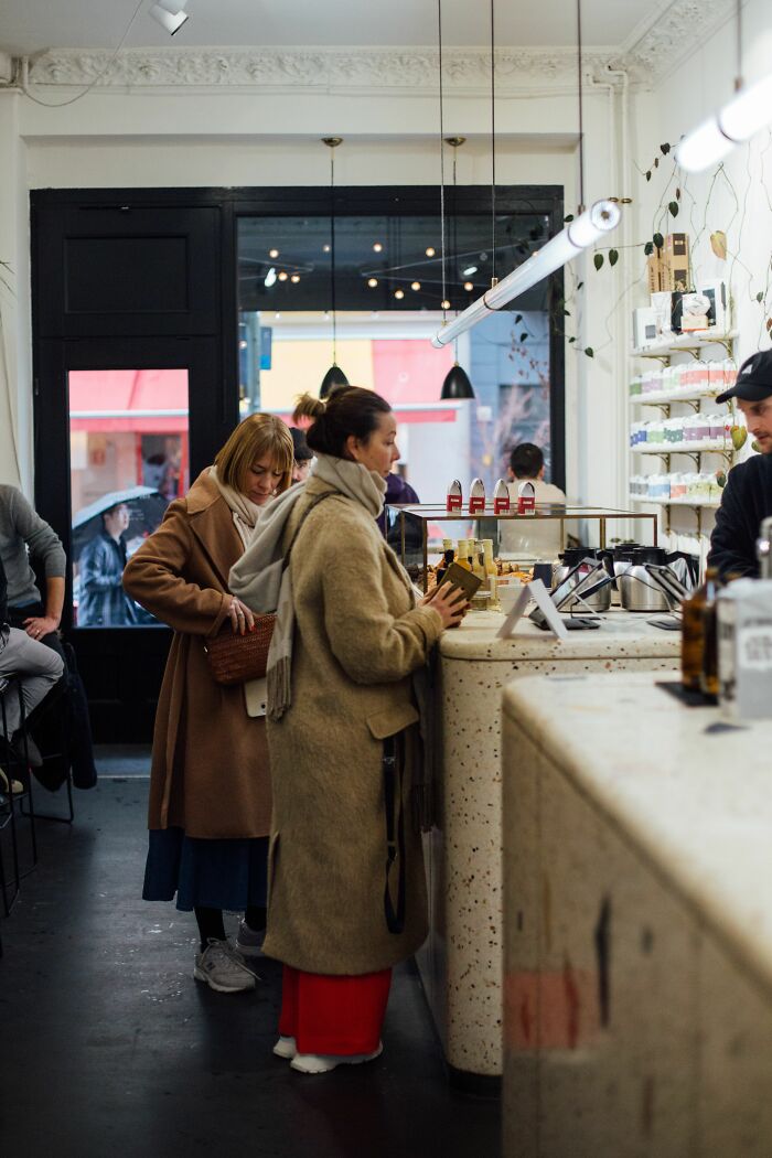 People misread social cues while shopping, leading to an awkward encounter at the counter.