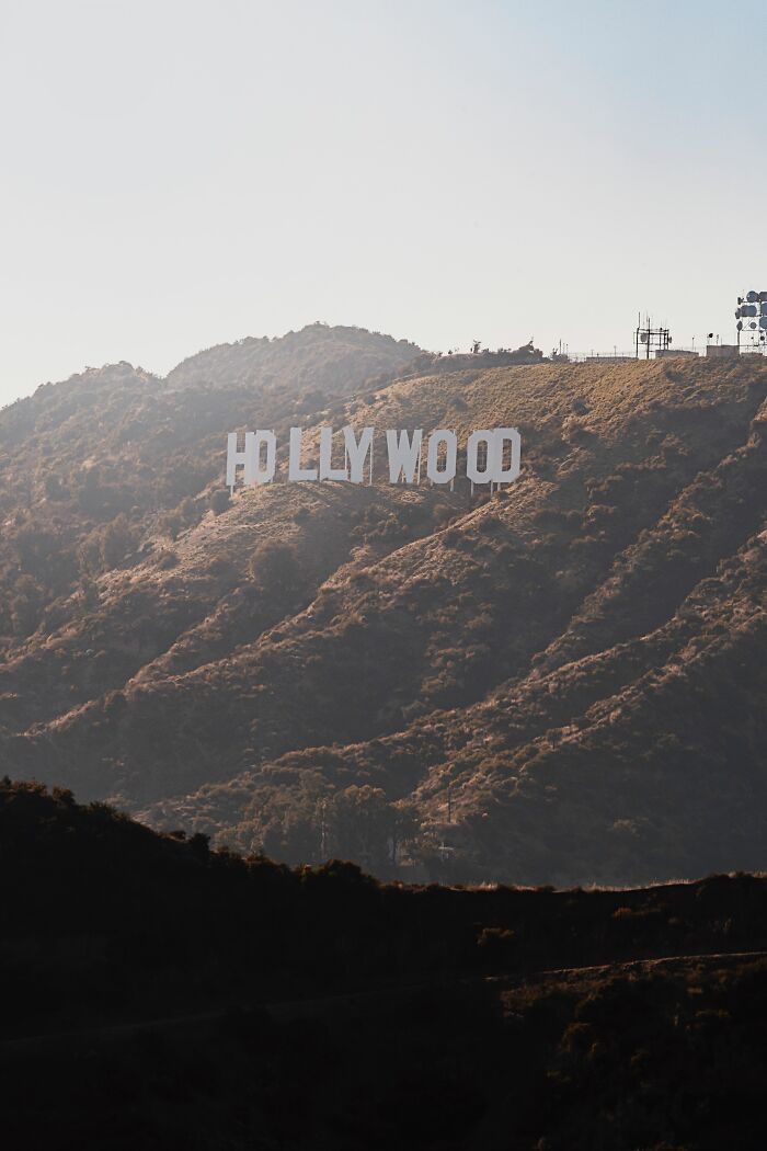 The iconic Hollywood sign on a sun-drenched hill, a fascinating fact about Los Angeles.