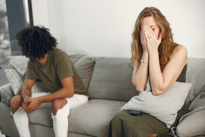 Upset couple ignoring each other after verbal fight illustrating savage women verbal weapons