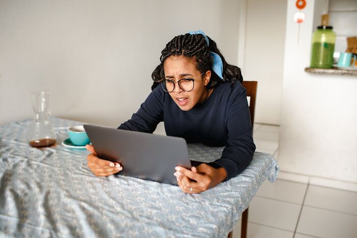 Woman shocked looking at tablet discovering infidelity stories