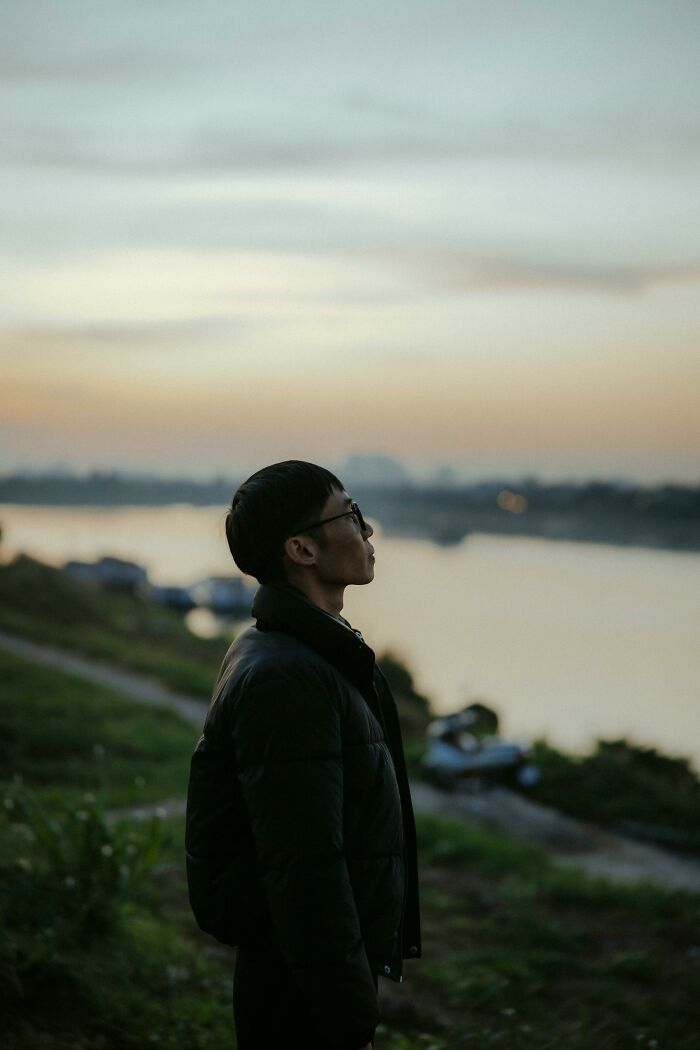 Man standing outdoors at dusk thinking about cheating moments