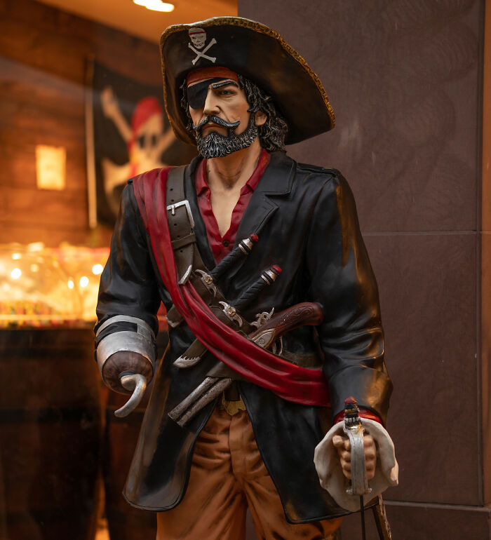 A pirate statue with an eye patch and hook hand, a weirdly hard to forget fact.