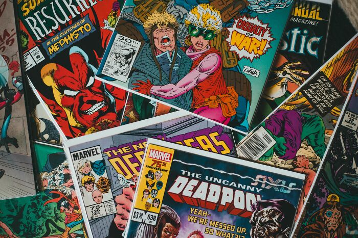 Collection of vintage Marvel comic books featuring Deadpool and other pop culture characters