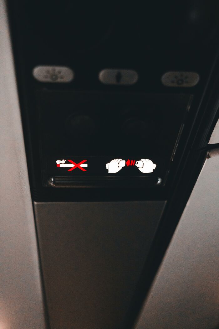 Airplane no smoking and fasten seatbelt signs illuminated during flight