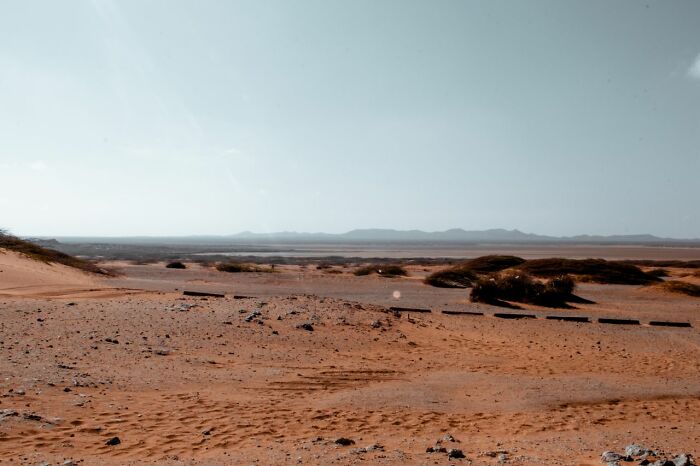 A vast desert landscape under a clear sky, highlighting one of 52 facts about Wyoming's 2 escalators.