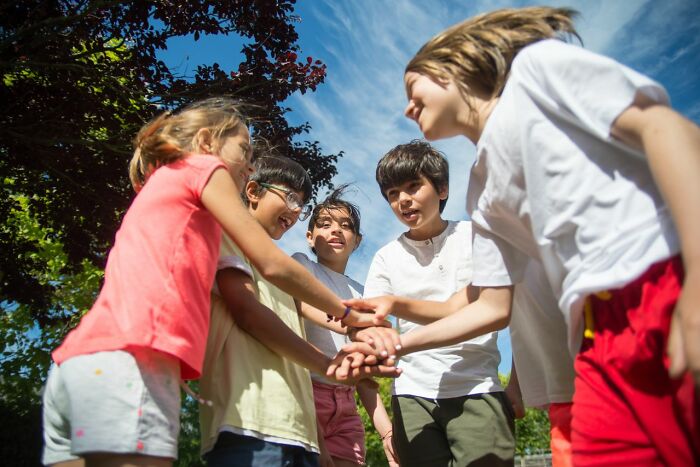 Children playing together, reflecting on experiences from polygamist families.