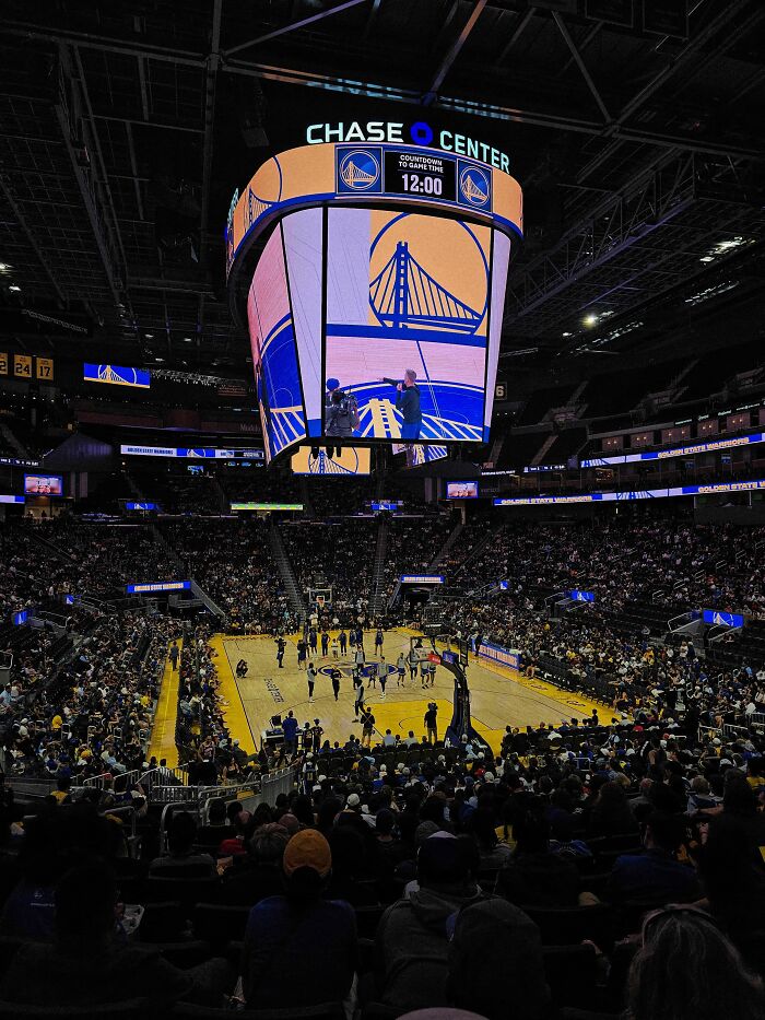 A wide shot of a basketball arena, the Chase Center, filled with fans, showing surprising facts about sports.