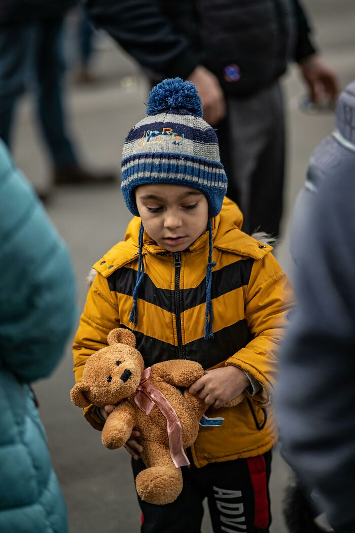 Young boy holding teddy bear, reflecting on moments of emotional pain