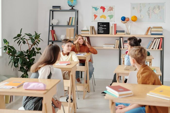 Diverse Gen Alpha students interacting during a class lesson