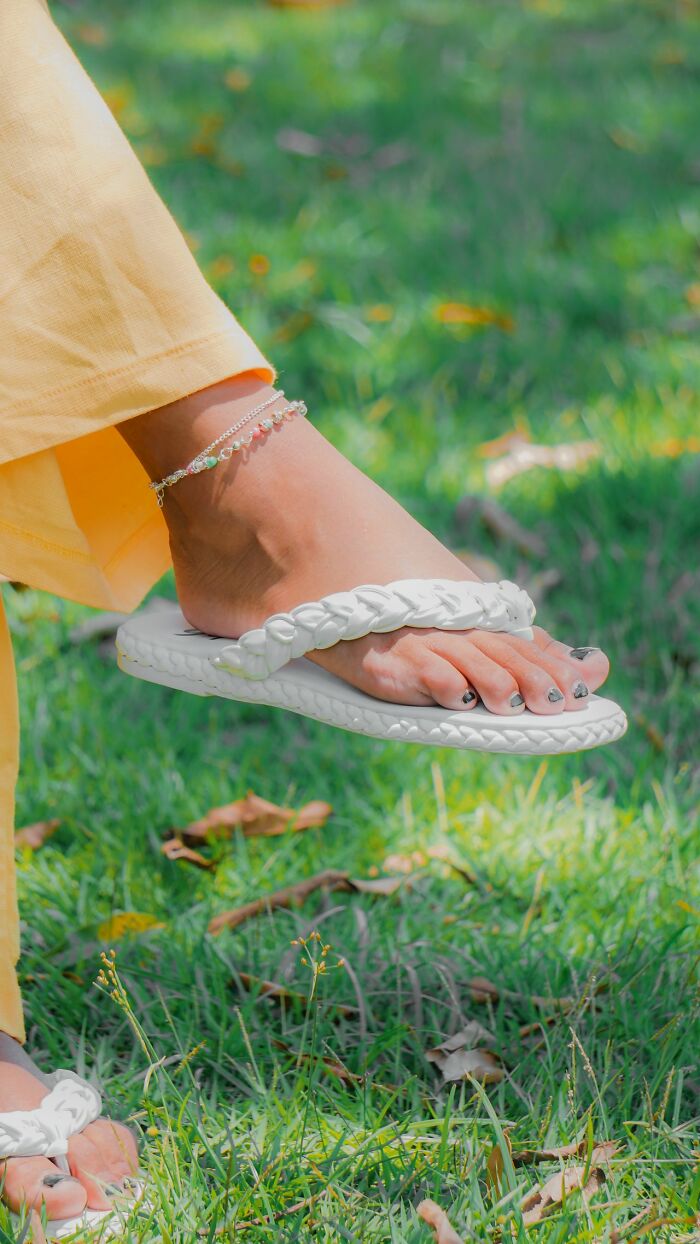 A person wearing a white flip-flop with painted toenails, suggesting a casual legal insider's perspective.