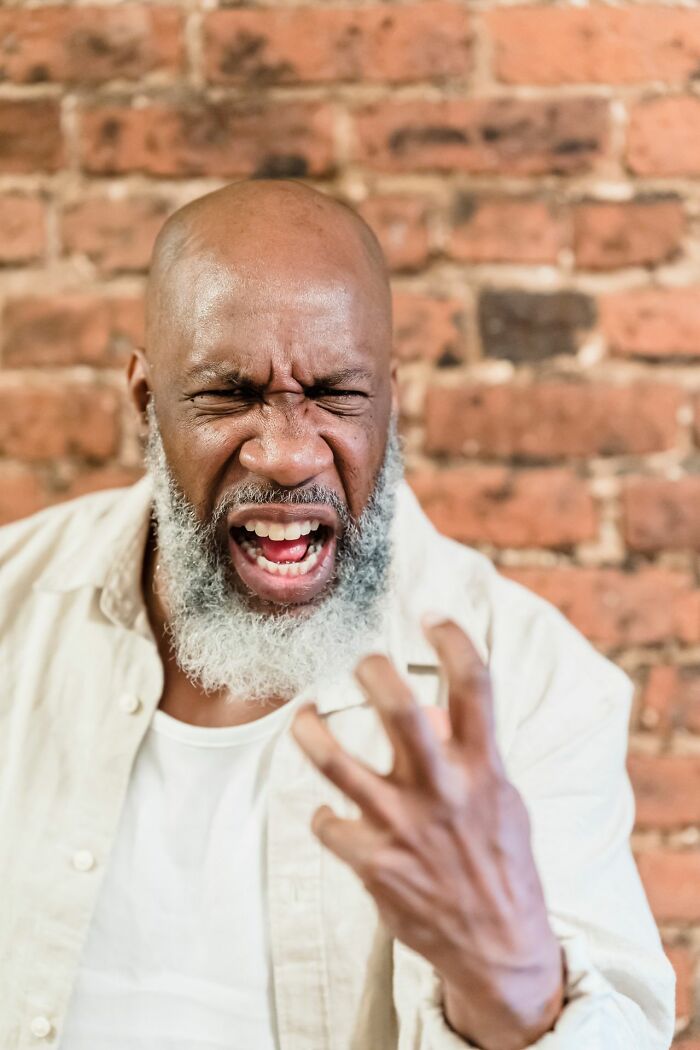 Frustrated man yelling expressing anger of entitled parents