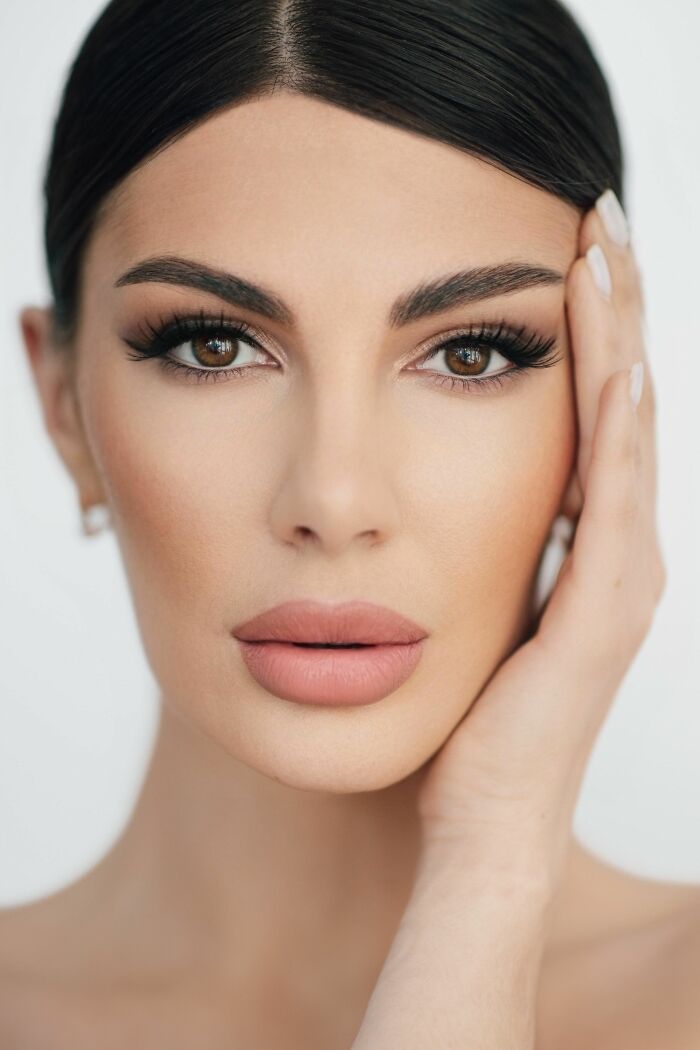 Close-up of a woman's face, reflecting on common turn offs.
