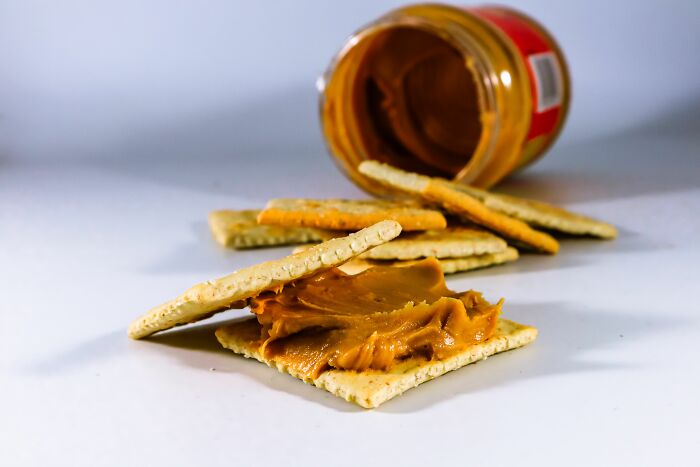 Peanut butter and crackers, with an open jar of peanut butter, depicting a moment people couldn't take it anymore.