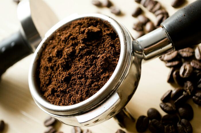 Close-up of ground coffee in espresso portafilter