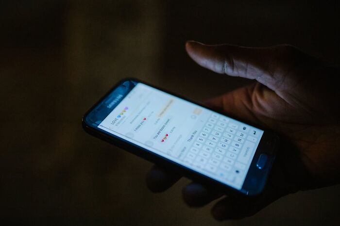 Close-up of phone screen with messages as shocking partner phone content